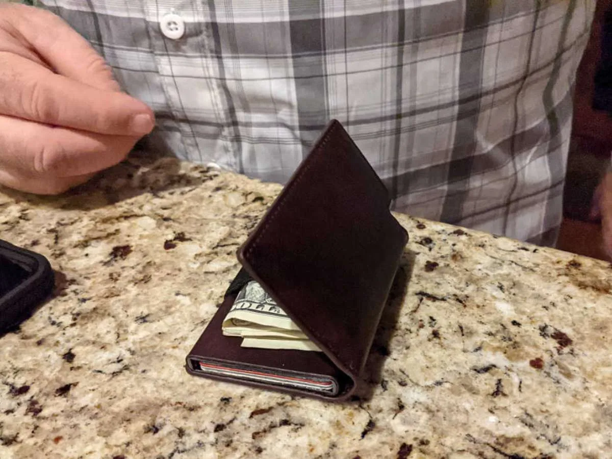 Now notice how the Ekster wallet doesn't really close properly when you have folded dollar bills inside. That's a bummer. 