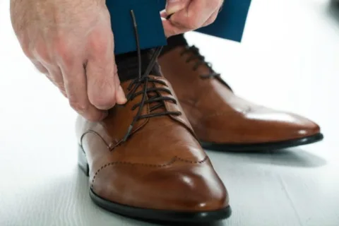 Examples of what colors of mens clothing to wear with a matching brown belt and shoes.
